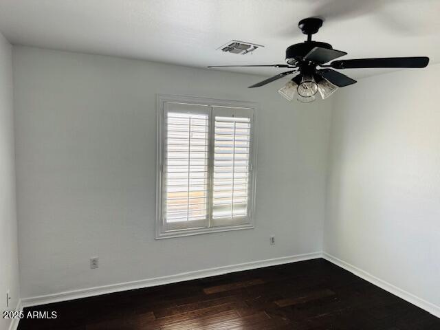 3502 W Belle Ave, San Tan Valley, AZ 85144 - unfurnished room with dark wood finished floors, baseboards, and ceiling fan