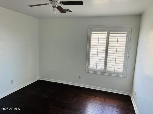 3502 W Belle Ave, San Tan Valley, AZ 85144 - spare room with hardwood / wood-style flooring, ceiling fan, baseboards, and plenty of natural light