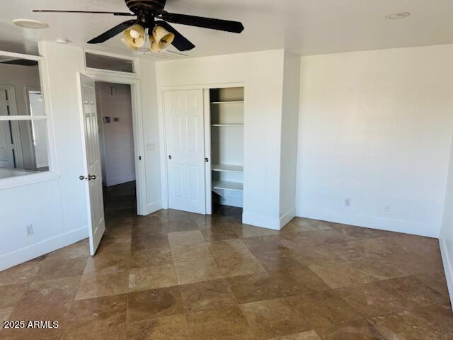 3502 W Belle Ave, San Tan Valley, AZ 85144 - unfurnished bedroom with baseboards, a closet, and ceiling fan