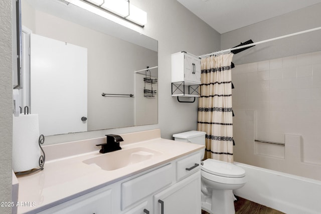 full bathroom with vanity, toilet, hardwood / wood-style floors, and shower / bath combo with shower curtain