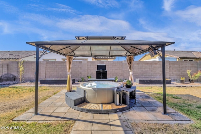 view of patio / terrace featuring a gazebo and a fireplace