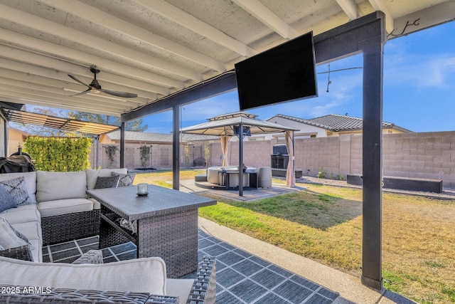 view of patio featuring an outdoor hangout area and ceiling fan