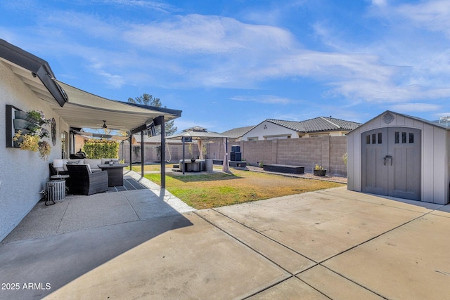 view of patio featuring an outdoor hangout area, ceiling fan, and a storage shed