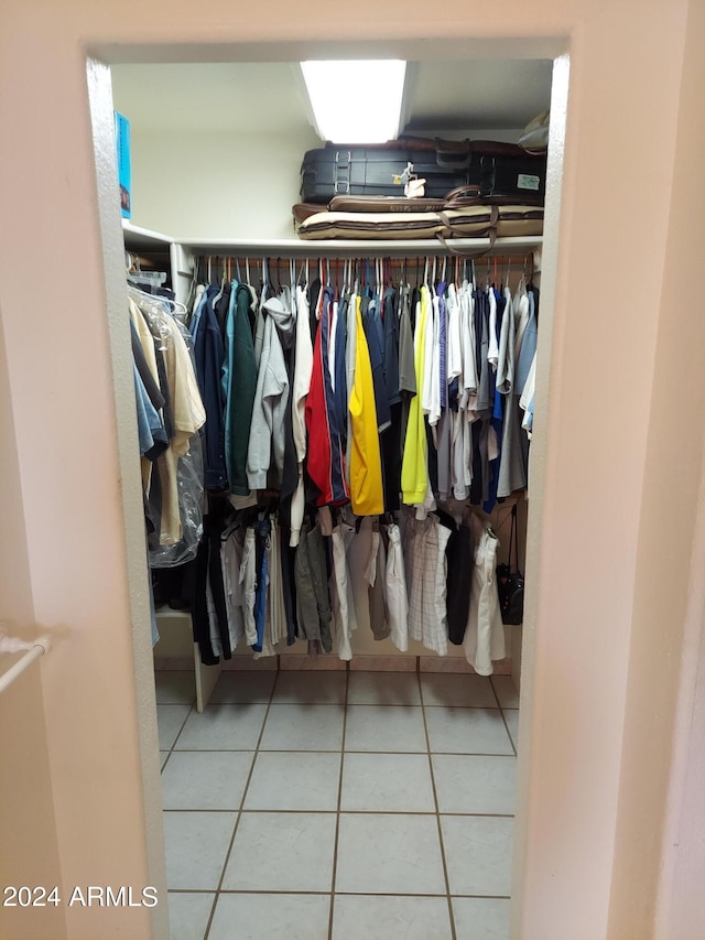 spacious closet with tile patterned floors