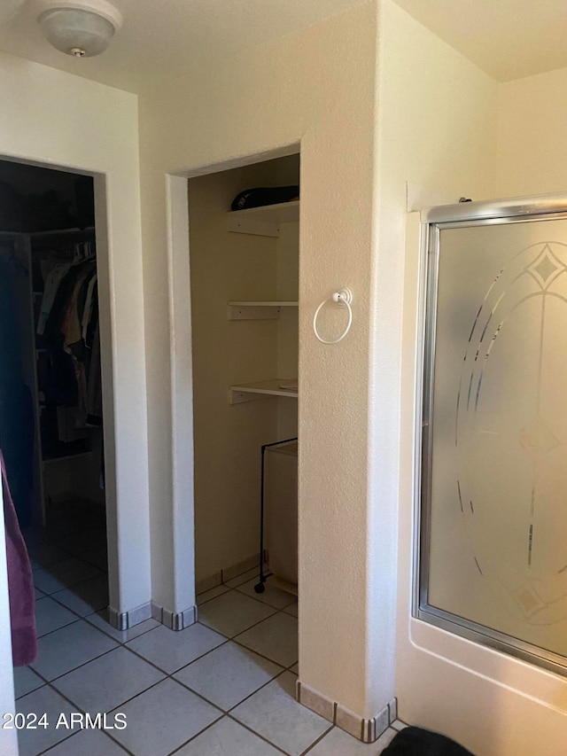 bathroom with tile patterned floors