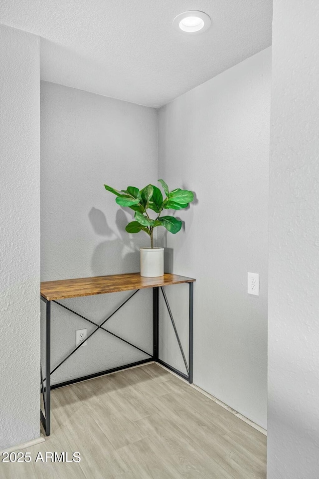 unfurnished office with light wood-type flooring