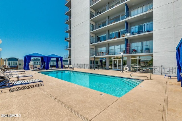 view of pool with a gazebo and a patio area