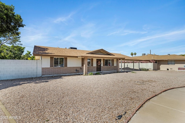 1215 E Geneva Dr, Tempe, AZ 85282 - ranch-style home with brick siding, covered porch, and a shingled roof