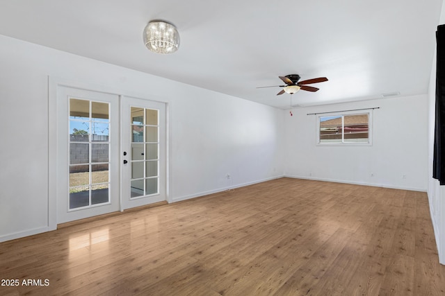 1215 E Geneva Dr, Tempe, AZ 85282 - empty room with light wood-style floors, ceiling fan, baseboards, and french doors