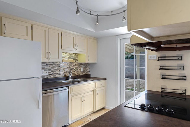 1215 E Geneva Dr, Tempe, AZ 85282 - kitchen featuring freestanding refrigerator, stainless steel dishwasher, a sink, dark countertops, and decorative backsplash