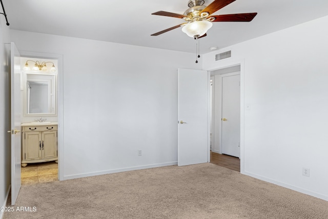 1215 E Geneva Dr, Tempe, AZ 85282 - unfurnished bedroom with light colored carpet, baseboards, a sink, and connected bathroom