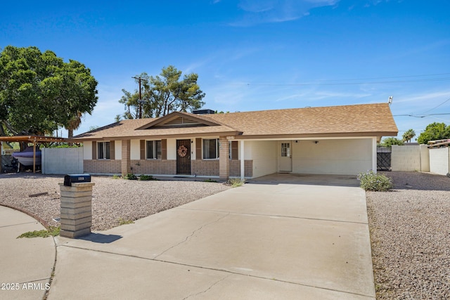 1215 E Geneva Dr, Tempe, AZ 85282 - ranch-style house featuring driveway, brick siding, a carport, and a shingled roof