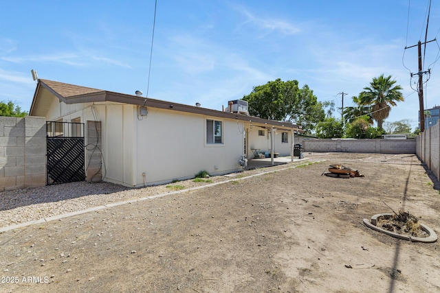 1215 E Geneva Dr, Tempe, AZ 85282 - rear view of property featuring an outdoor fire pit, a fenced backyard, and a patio area