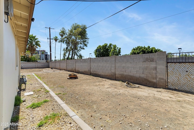 1215 E Geneva Dr, Tempe, AZ 85282 - fenced backyard featuring a fire pit
