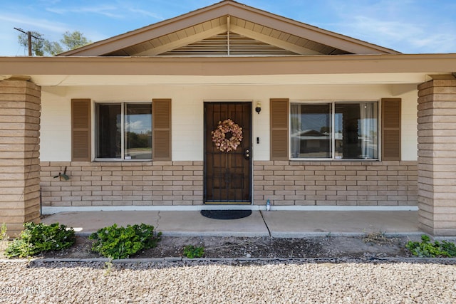 1215 E Geneva Dr, Tempe, AZ 85282 - doorway to property with covered porch and brick siding