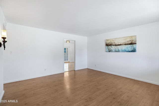 1215 E Geneva Dr, Tempe, AZ 85282 - empty room featuring wood finished floors and baseboards