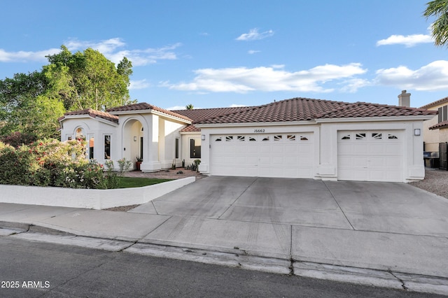 16662 S 37th Way, Phoenix, AZ 85048 - mediterranean / spanish house with stucco siding, a garage, a tiled roof, and concrete driveway