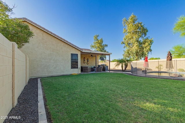 3532 W Mesquite Ave, San Tan Valley, AZ 85144 - fenced backyard with an outdoor living space, ceiling fan, and a patio