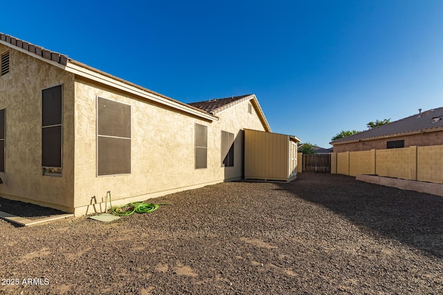 3532 W Mesquite Ave, San Tan Valley, AZ 85144 - back of property featuring a fenced backyard and stucco siding