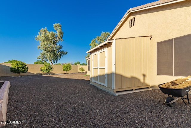 3532 W Mesquite Ave, San Tan Valley, AZ 85144 - fenced backyard featuring a storage unit