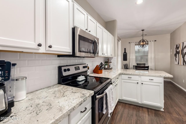 3532 W Mesquite Ave, San Tan Valley, AZ 85144 - kitchen featuring stainless steel appliances, a peninsula, white cabinets, dark wood-style flooring, and a chandelier