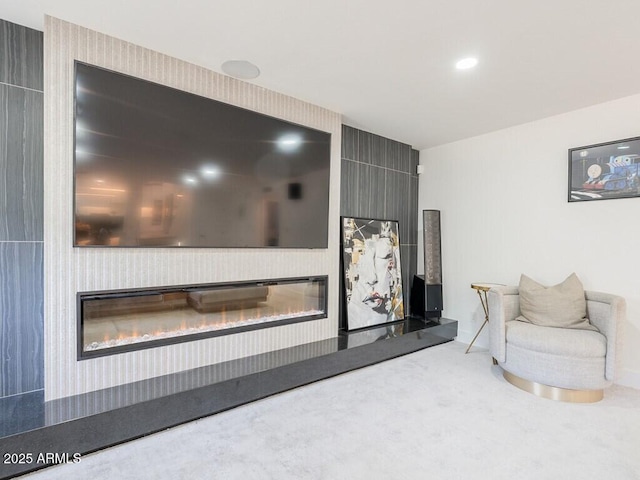 4748 E Redfield Rd, Phoenix, AZ 85032 - living area with a glass covered fireplace, carpet flooring, and baseboards