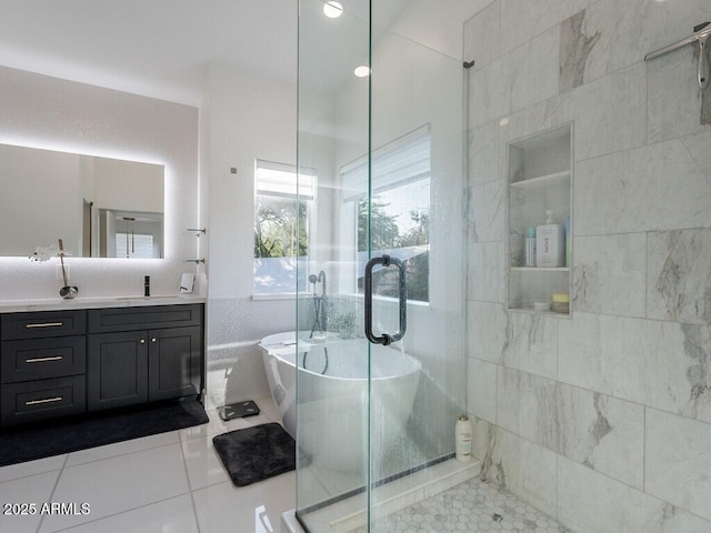 4748 E Redfield Rd, Phoenix, AZ 85032 - full bathroom with tile patterned floors, a shower stall, vanity, a freestanding bath, and tile walls