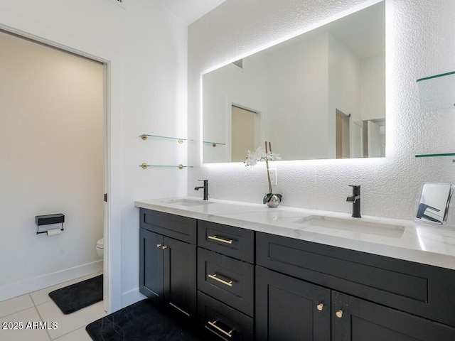 4748 E Redfield Rd, Phoenix, AZ 85032 - bathroom featuring toilet, tile patterned floors, double vanity, and baseboards