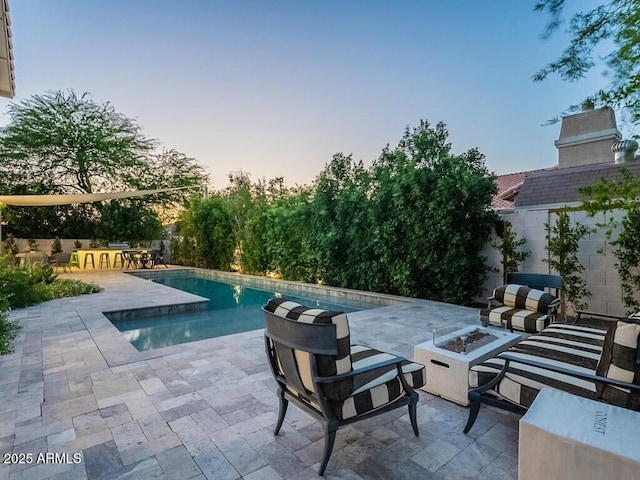 4748 E Redfield Rd, Phoenix, AZ 85032 - pool at dusk featuring a fire pit, an outdoor pool, and a patio