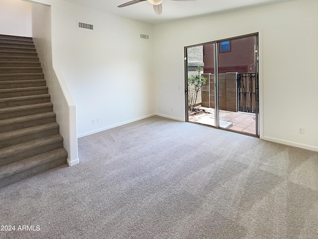 unfurnished room featuring carpet flooring and ceiling fan