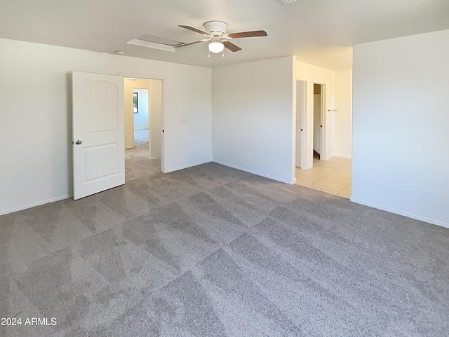 carpeted empty room with ceiling fan