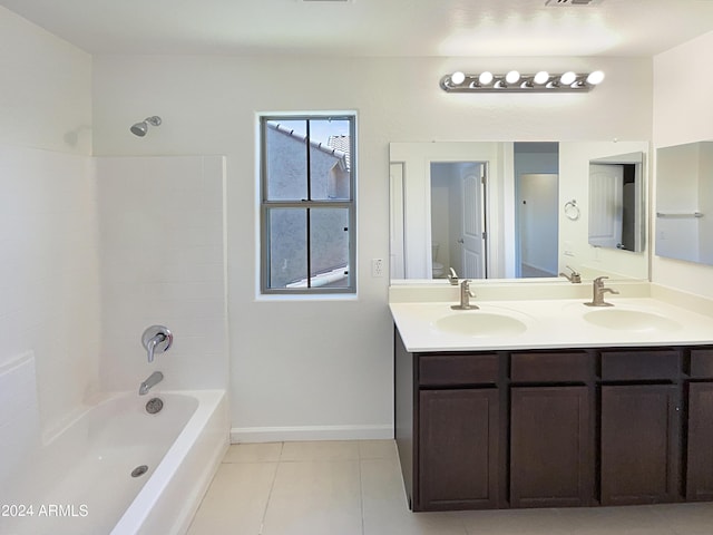 bathroom with bathing tub / shower combination, tile patterned floors, and vanity