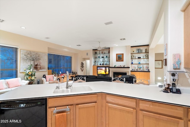 kitchen featuring a sink, black dishwasher, open floor plan, and light countertops