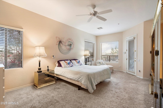 bedroom featuring visible vents, baseboards, ceiling fan, and carpet flooring