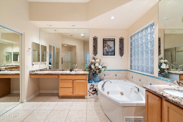 bathroom with a tub with jets, visible vents, a sink, a shower stall, and tile patterned floors