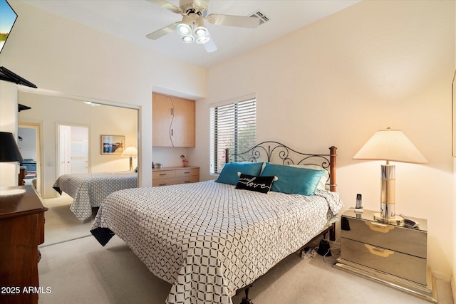 bedroom with visible vents, ceiling fan, and carpet flooring