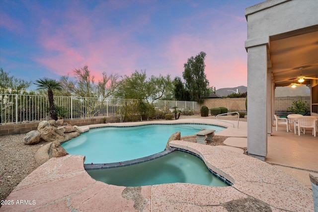 view of swimming pool featuring a patio, a fenced backyard, and a fenced in pool