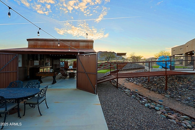 view of patio with an outbuilding