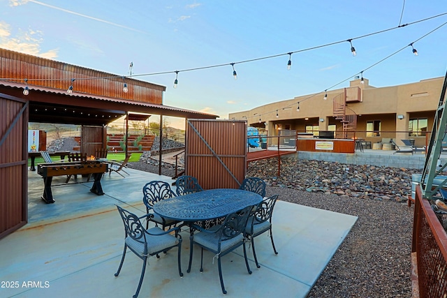 view of patio with outdoor dining area and area for grilling