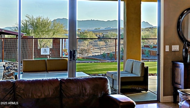 living room featuring french doors and a mountain view