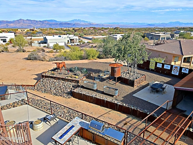 birds eye view of property with a mountain view