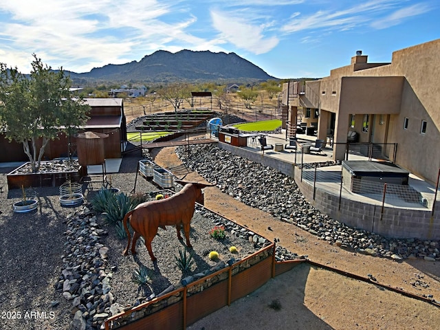 view of yard featuring a mountain view, a patio, and fence