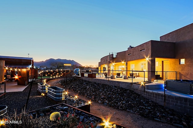 view of yard featuring a patio, fence, and an outdoor fire pit