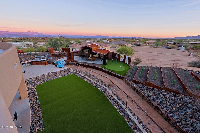 birds eye view of property featuring a mountain view