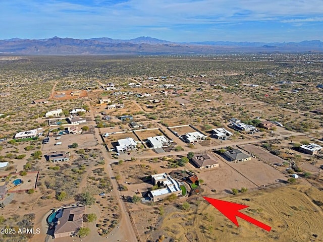 aerial view featuring view of desert and a mountain view