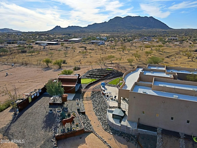 birds eye view of property featuring a mountain view