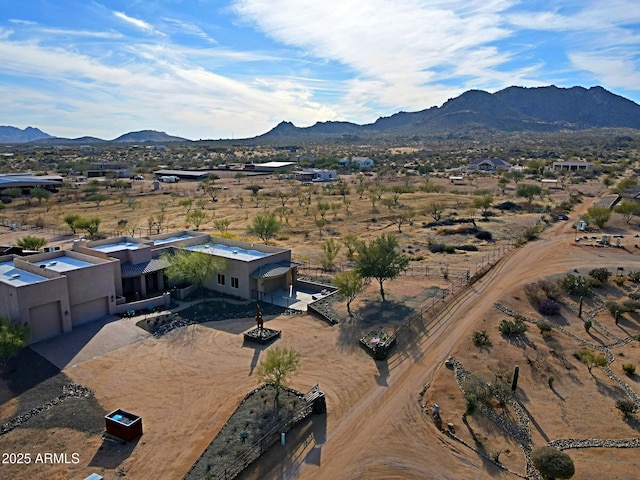 birds eye view of property with a mountain view