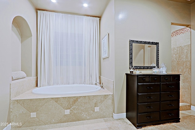 full bathroom featuring recessed lighting, vanity, and a garden tub