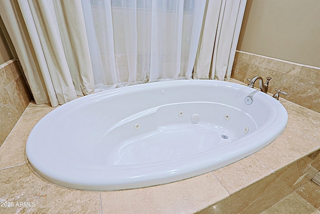 full bath featuring a tub with jets