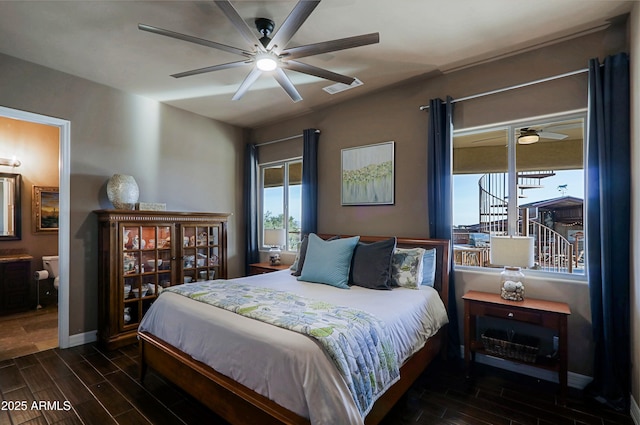 bedroom featuring baseboards, visible vents, and wood finish floors